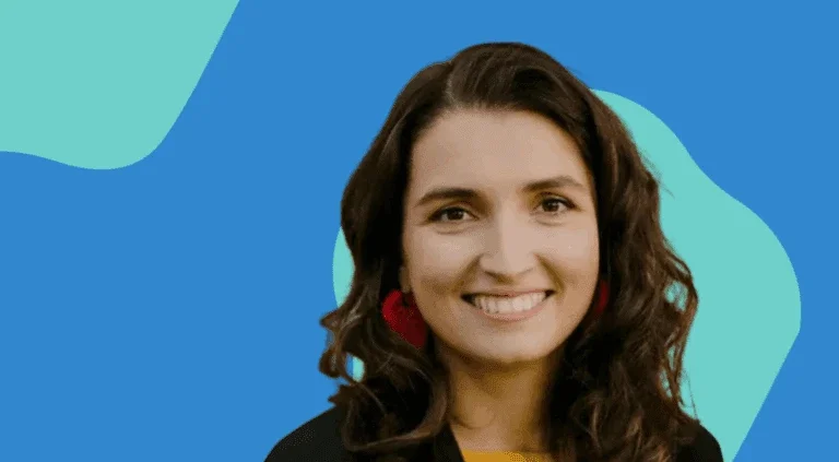 professional headshot of Marina Zhavoronkova against a blue and teal abstract background